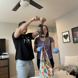 Well Rounded Momma - Daddy weighing baby