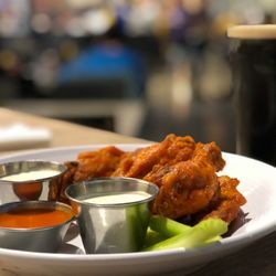 Corner Pub Downtown - Chicken wings with various sauces.