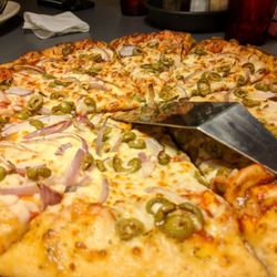 Pizza Hut - Olive onion Hand tossed pizza. Tasted undercooked and soggy.