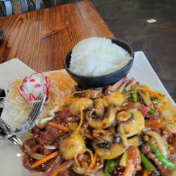 Chiyoda - Mongolian Beef with white rice and cabbage salad and a radish shaped like a flower. Beautiful presentation.