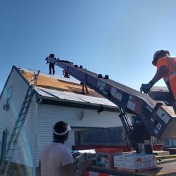 JR's Roofing and Gutters - Rooftop delivery of shingles to our jobsite