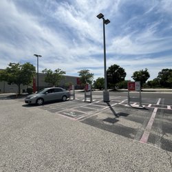 Target - Has one little sign that says "Drive Up" but it's blocked by a tree.