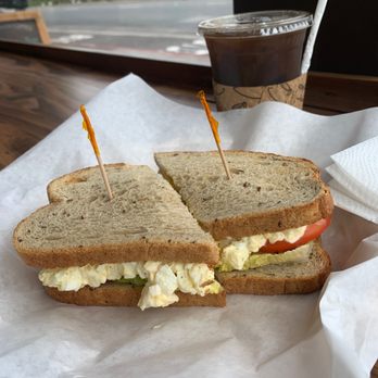 Royal Ground Coffee - Egg salad sandwich with rye bread and black coffee with almond milk. - Coffee & Tea Near Me - San Francisco, California Royal Ground Coffee - Egg salad sandwich with rye bread and black coffee with almond milk. - Coffee & Tea Near Me - San Francisco, California