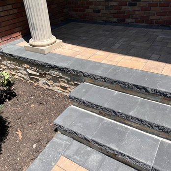 Top Craft Paving & Masonry - blacktop driveway with belgium block edge and Cambridge armortec paver apron and stoops with veneer stone facing - Masonry/Concrete Near Me - Medford, New York Top Craft Paving & Masonry - blacktop driveway with belgium block edge and Cambridge armortec paver apron and stoops with veneer stone facing - Masonry/Concrete Near Me - Medford, New York