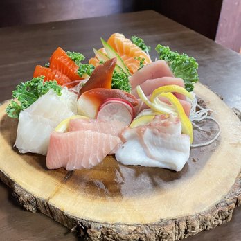 Sushi Umibe - a plate of sushi on a wood slab - Japanese Near Me - Maple Ridge, British Columbia