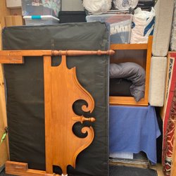 Scrawny Wimp Moving - Blanket on the ground to keep bed off floor. Box spring will be used to secure the load using a ratchet strap.