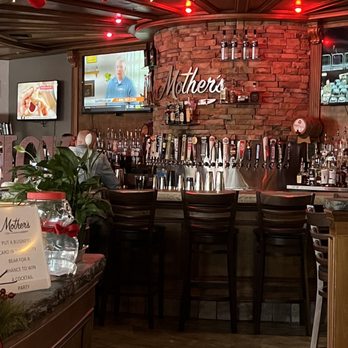 Mother's - a bar with christmas stockings hanging from the ceiling - American Near Me - Tampa, Florida