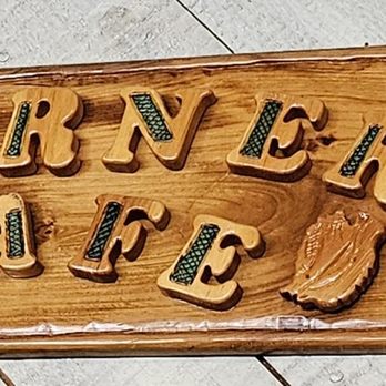 The Corner Cafe - a wooden sign on the floor - Cafes Near Me - Pocasset, Massachusetts