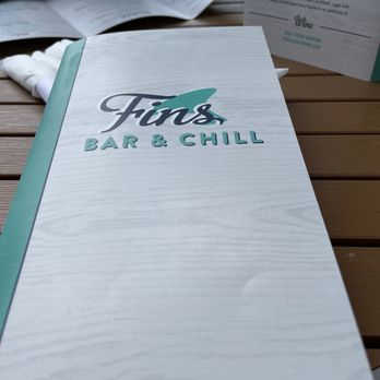 Fins Bar And Chill - a menu on a table - Bars Near Me - Pigeon Forge, Tennessee