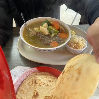 Mariano’s - a person eating a bowl of soup - Salvadoran Near Me - San Antonio, Texas Mariano’s - a person eating a bowl of soup - Salvadoran Near Me - San Antonio, Texas
