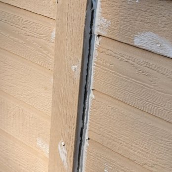 208 Irrigation and Landscape - a close up of a house's siding - Landscaping Near Me