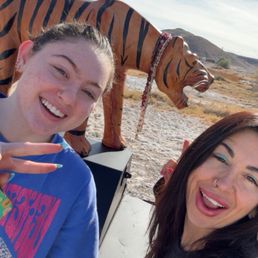 Outside of our bungalow with this lovely tiger given as a gift Outside of our bungalow with this lovely tiger given as a gift