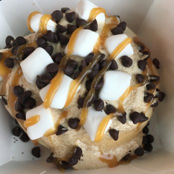 Cinnaholic - Coffee frosting, chocolate chips, marshmallows, and caramel sauce topped a cinnamon roll. - Bakeries Near Me - Indian Trail, North Carolina