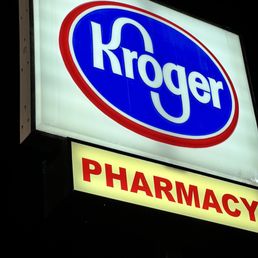 a kroger pharmacy sign at night