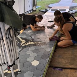 Sunset Park - Coworkers meticulously adding to the mosaic tile walk