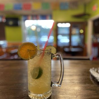 Dos Botellas - a drink with a straw and a slice of lime - Mexican Near Me - Birmingham, Alabama Dos Botellas - a drink with a straw and a slice of lime - Mexican Near Me - Birmingham, Alabama