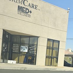 Trimcare - Dirty exterior with medical waste boxes at the entrance floor. Broken blinds, weeds, a view into the medical suite.