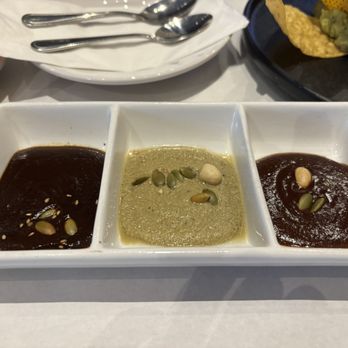 Manchamanteles Restaurant - A sampling of three moles. The dark, green and brown. I suggest you try the dark which is a bit more spicier. There are two other types - Mexican Near Me - Chicago, Illinois
