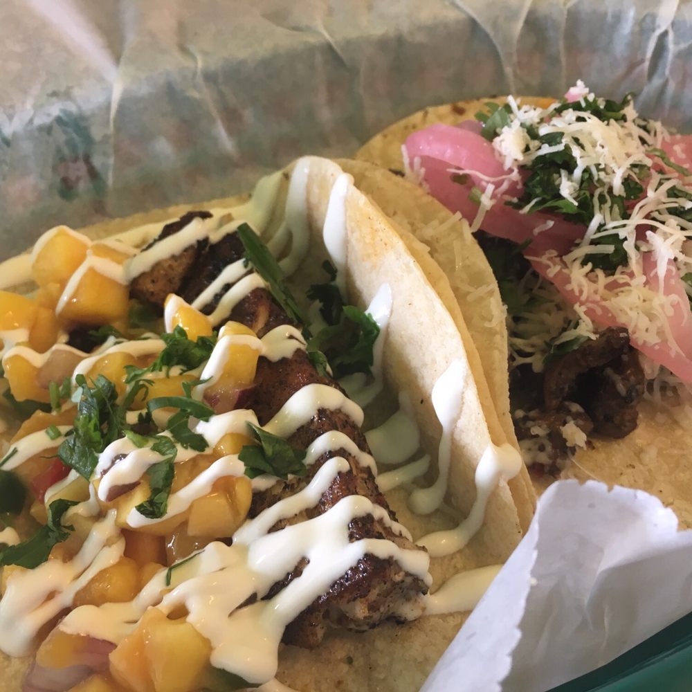 One Hawaiian fish taco and one carne asada taco