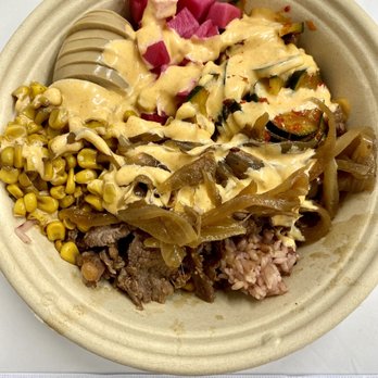 Seoul Bowl - Bulgogi bowl w/ egg, corn, pickled daikon, kimchi cucumber, grilled onions, and yum yum sauce - Korean Near Me - Bothell, Washington