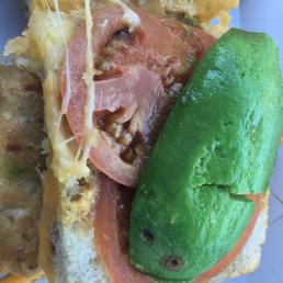 Tomato slices were mush and avocado with brown spots that were both added cost