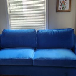 Electric blue sofa about 82" wide. Electric blue sofa about 82" wide.