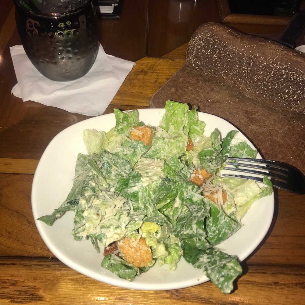 Outback Steakhouse - Caesar salad, mule and house bread - Steakhouses Near Me - Schaumburg, Illinois Outback Steakhouse - Caesar salad, mule and house bread - Steakhouses Near Me - Schaumburg, Illinois