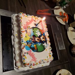 a birthday cake with mickey mouse on it a birthday cake with mickey mouse on it