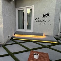 Castillo Landscaping - 3x3 Diamond Grey Concrete Slabs with Turf in Gaps. 
Cantilever Floating Steps with Lighting.