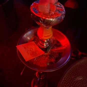 House of Hookah - a table with a lit candle on it - Hookah Bars Near Me - Atlanta, Georgia House of Hookah - a table with a lit candle on it - Hookah Bars Near Me - Atlanta, Georgia