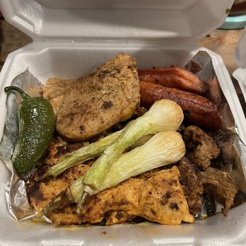 Nacho Kat - The Parilladas. Chicken, steak, pork chop, sausage. Delicious grilled onions and poblano. - Latin American Near Me - Covington, Louisiana