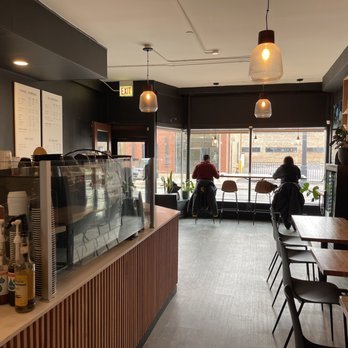 Two Mile Coffee Bar - two people sitting at tables - Coffee & Tea Near Me - Chicago, Illinois