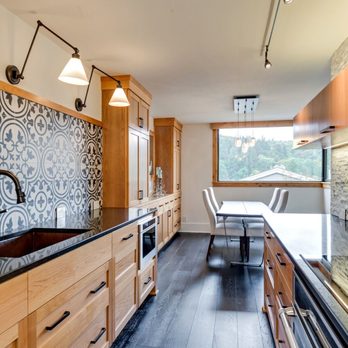 Crystal Remodeling - a kitchen with a black and white tile backsplash - General Contractors Near Me - Wilsonville, Oregon Crystal Remodeling - a kitchen with a black and white tile backsplash - General Contractors Near Me - Wilsonville, Oregon
