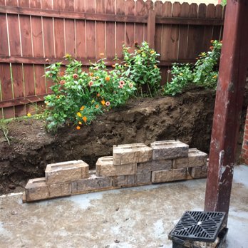 Full 9 Yards - a raised garden bed with bricks - Lawn Services Near Me