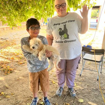 Fang & Claw Mobile Grooming - BEFORE pic of my son with his dog Canelo and Candace(the groomer) - Pet Groomers Near Me