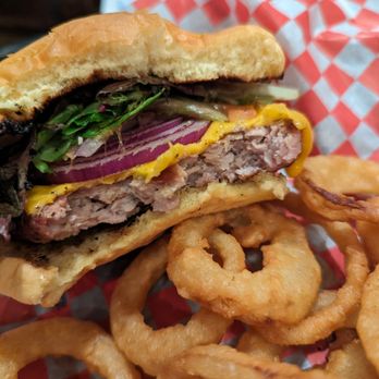 Boar's Head Pub - Boar Burger with onion rings. - Hotels Near Me - Stratford, Ontario Boar's Head Pub - Boar Burger with onion rings. - Hotels Near Me - Stratford, Ontario