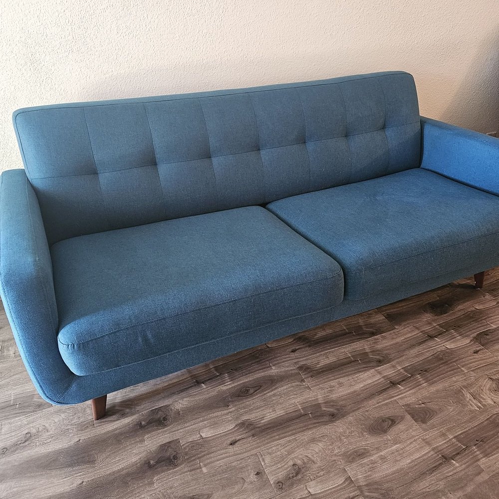 Perfectly cleaned couch! Stains, dust, and pet hair is gone. The teal color looks fresh again!!