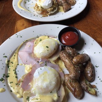 Penny Black - Front: Canadian bacon eggs benedict (brunch menu), back: crab cake eggs benedict - Bars Near Me - Baltimore, Maryland