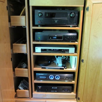 Digital Solutionz - Everything is tucked away nice and neat. All components are properly protected from surges and overheating. - Home Theatre Installation Near Me