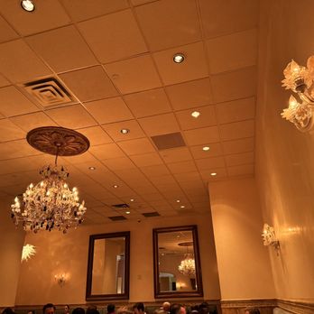 Luce - a chandelier hanging from the ceiling - Italian Near Me - Charlotte, North Carolina