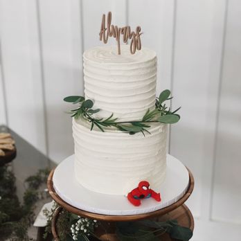 Craved Creations - a white wedding cake with a red ribbon - Bakeries Near Me - League City, Texas Craved Creations - a white wedding cake with a red ribbon - Bakeries Near Me - League City, Texas