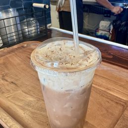 Iced mocha latte almond milk cold foam with coconut shavings. Iced mocha latte almond milk cold foam with coconut shavings.