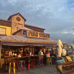 Exterior outside entrance of Fish Tales - Small bar at golden hour - Ocean City, Maryland Exterior outside entrance of Fish Tales - Small bar at golden hour - Ocean City, Maryland