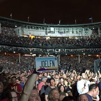 Wrigley Field - So, I'm used to seeing IL plates in AZ but an AZ plate in Wrigley! I did not expect. Serious fan! And seats right this guy. So crazy :-) - Stadiums & Arenas Near Me - Chicago, Illinois