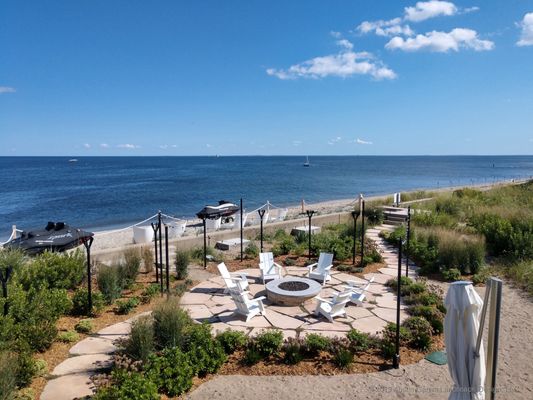 Beachside Garden & Firepit - Austin Ganim Landscape Design offers a full range of landscape & garden design, installation, and maintenance services for both residential and commercial properties. Our well trained staff encompasses a licensed landscape architect, college educated horticulturists, and full service maintenance & installation crews with decades of experience. Our association with Ganim's Garden Center & Florist, allows our clients the luxury of previewing a wide variety of plant material. Whether you are looking for a long term master plan for your property or just freshening up your garden for a party we are here to help make your landscape dreams a reality.