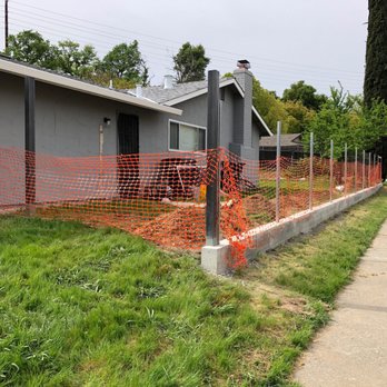 Millsaw Construction and Remodeling - During - old fence removed, fence posts installed, cement retaining wall almost finished - General Contractors Near Me - Rocklin, California Millsaw Construction and Remodeling - During - old fence removed, fence posts installed, cement retaining wall almost finished - General Contractors Near Me - Rocklin, California