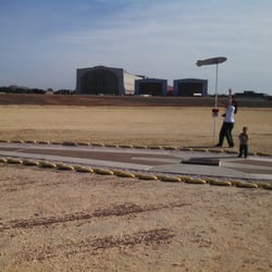 Hindenburg Crash Site - Ground Zero. This marker was placed 50 years post crash at the spot where the Hindenburg landed The background is Hangar 1.