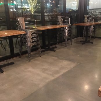 Slapfish - This was literally the section I was still eating in, they decided to stack all the metal chairs while I'm still trying to enjoy my dinner - Seafood Near Me - Park City, Utah