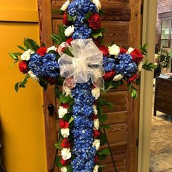 Martha Mae's Floral & Gifts - Patriotic floral cross spray for a US Veteran