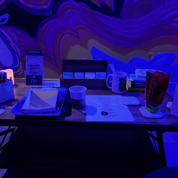 IMR Float - Coffee table in Zen room with tea, journals, sketchbooks and various other items to keep you entertained and Zen... - Float Spa Near Me - Henderson, Nevada